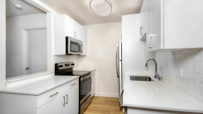 Kitchen with Stainless Steel Appliances and Quartz Countertops - Arbor Terrace