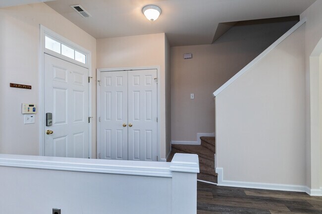 Coat closet and stairs - 812 Walnut Woods Dr
