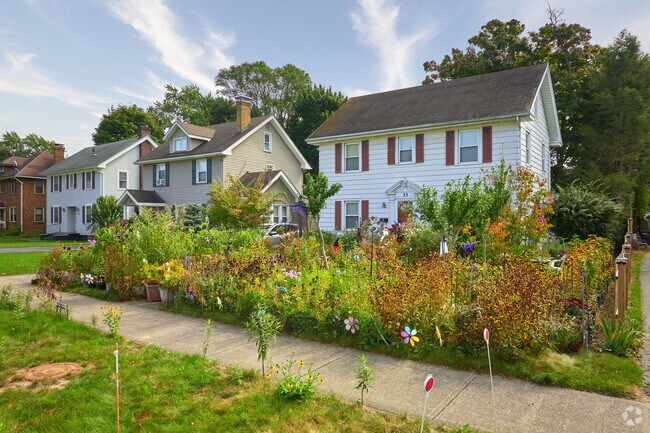 Many homes have well-maintained, landscaped yards on picturesque streets.