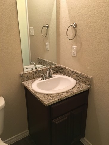 Granite even in the half bath - Maple Ridge Townhomes