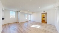Located at 15528 Rayen St in the North Hills neighborhood of Los Angeles, this thoughtfully designed 1-bedroom, 1-bathroom unit offers a clean, modern aesthetic throughout its single-floor layout. Light wood plank flooring flows seamlessly across the entire space, creating a warm and cohesive feel.

The open living area is bright and airy, benefiting from multiple windows that frame views of the surrounding neighborhood and distant mountains. Recessed lighting adds to the clean, contemporary look, while a bold navy entry door makes a striking first impression. A second living area provides added flexibility for use as a dining space or home office.

The galley-style kitchen is well-appointed with white shaker cabinets, dark countertops, stainless steel appliances including a gas range and dishwasher, and a large window that floods the workspace with natural light.

The bedroom is a comfortable size, featuring a large sliding-door closet with built-in shelving, a window with mountain views, and the same light wood flooring found throughout. The full bathroom includes a white vanity with dark countertop, a tiled shower-over-tub combination, and recessed lighting for a clean, finished look.

A hallway connects the main living spaces, contributing to an efficient and functional floor plan throughout this well-designed Los Angeles unit.