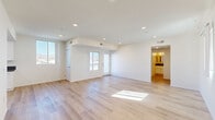 Located at 15528 Rayen St in the North Hills neighborhood of Los Angeles, this thoughtfully designed 1-bedroom, 1-bathroom unit offers a clean, modern aesthetic throughout its single-floor layout. Light wood plank flooring flows seamlessly across the entire space, creating a warm and cohesive feel.

The open living area is bright and airy, benefiting from multiple windows that frame views of the surrounding neighborhood and distant mountains. Recessed lighting adds to the clean, contemporary look, while a bold navy entry door makes a striking first impression. A second living area provides added flexibility for use as a dining space or home office.

The galley-style kitchen is well-appointed with white shaker cabinets, dark countertops, stainless steel appliances including a gas range and dishwasher, and a large window that floods the workspace with natural light.

The bedroom is a comfortable size, featuring a large sliding-door closet with built-in shelving, a window with mountain views, and the same light wood flooring found throughout. The full bathroom includes a white vanity with dark countertop, a tiled shower-over-tub combination, and recessed lighting for a clean, finished look.

A hallway connects the main living spaces, contributing to an efficient and functional floor plan throughout this well-designed Los Angeles unit.