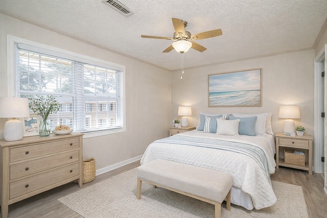 Spacious Bedroom with Large Windows - Pebble Creek Apartments