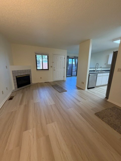 Family Room with New Flooring and Gas Fireplace Throughout - 18294 W 58th Pl (Golden, CO)