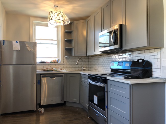 Gray Kitchen Cabinets with White Quartz - 3951 N Hoyne Ave