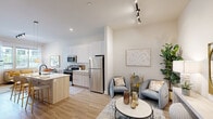 Located at 415 Stump Rd in Montgomeryville, PA, this thoughtfully designed 2-bedroom, 1-bathroom residence offers a bright and modern living experience across a single floor. The open-concept layout seamlessly connects the kitchen and living room, creating an inviting, airy atmosphere enhanced by light wood-style flooring and crisp white walls throughout.

The kitchen is a standout feature, boasting sleek white upper cabinetry, warm wood-toned lower cabinets, stainless steel appliances including a refrigerator, microwave, and range, and a generous island with seating — perfect for casual dining or entertaining. Track lighting and a pendant fixture above the island add a contemporary touch.

The living room offers ample natural light through large windows with outdoor views, and flows effortlessly from the kitchen. Both bedrooms are carpeted and well-lit with windows, providing a comfortable and peaceful retreat. The primary bedroom includes a walk-in closet, while the second bedroom functions equally well as a home office or flex space. The full bathroom features light, clean finishes consistent with the overall aesthetic. A dedicated closet adds practical storage. The space combines modern design with functional living in a compact, efficient footprint.