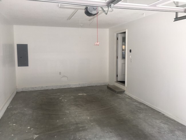 Enclosed one care garage with remote opener - 1207 N Oak St