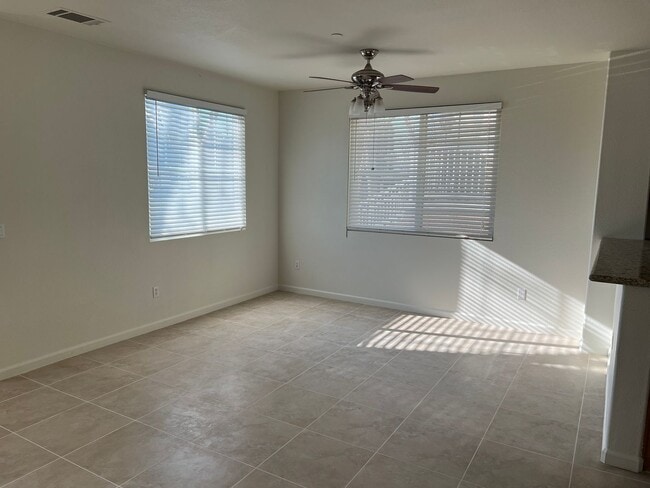 Building Photo - MODERN LIVING WITH TILE FLOOR DOWN AND NEW CARPET UP. OPEN FLOOR PLAN AND HIGH CEILINGS!!!