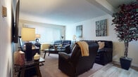 Located at 2929 Curry Pkwy in Madison, Wisconsin, this single-floor residence offers a well-organized layout with a range of functional and comfortable living spaces. The living room is generously sized, featuring large vertical-blind windows that allow ample natural light to fill the room, neutral-toned carpet flooring, and a warm, welcoming ambiance. The kitchen is outfitted with rich dark wood cabinetry, granite-style countertops, stainless steel appliances including a refrigerator, gas range, and microwave, and light hardwood-style flooring that adds a clean, modern touch. The bedroom provides a calm retreat, with a wide window fitted with vertical blinds, soft carpeted floors, and ample space for furnishings. The full bathroom includes a tub-shower combination with wood-paneled surround walls, while a second bathroom features a dark wood vanity with a white countertop and panel-style doors with brushed nickel hardware. Throughout the home, neutral wall tones and consistent finishes create a cohesive aesthetic. The overall layout, as seen in the floor plan, includes multiple rooms that flow efficiently, making this a practical and comfortable single-floor residence in Madison's south side.