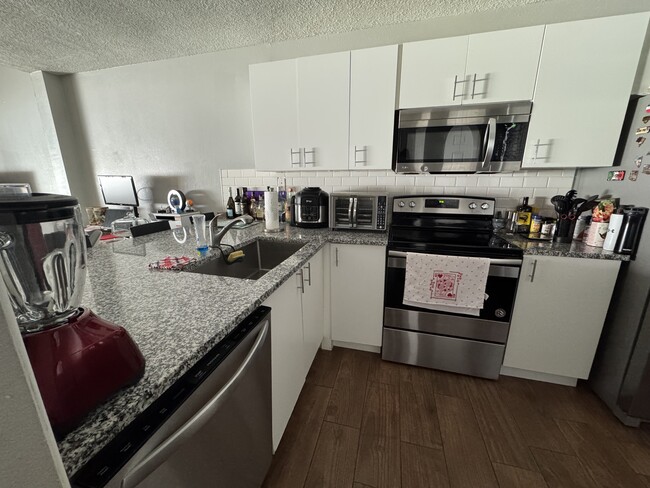 Kitchen with new cabinets and countertops - 5082 Ernst Ct