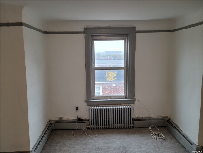 Building Photo - 134-20-134-57 57th Ave