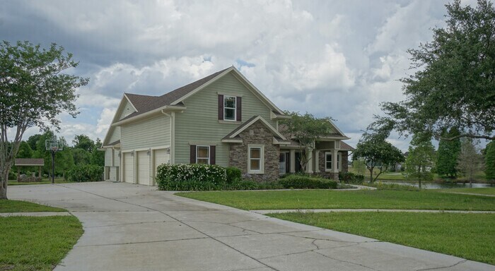 Primary Photo - 4-bedroom, 3-bath and 3.5-car garage on pond
