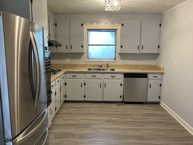 Kitchen with Stainless Steel Refrigerator and Dishwasher - 143 Windy Hills Dr