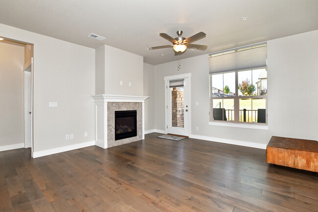 Spacious great room with wood floors and fireplace - 6510 Crystal Downs Dr