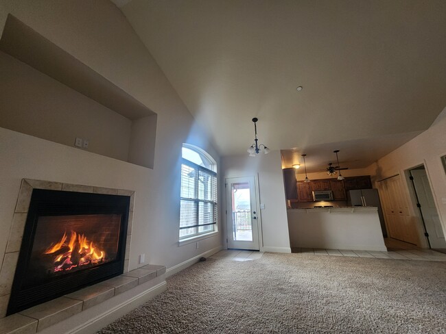 living room with tv wall inset and gas fireplace - 4100 Mullan Rd