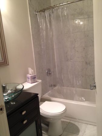 Bathroom with Marble tile.- there is a new vanity pic coming soon - 600 Broadway Ave NW