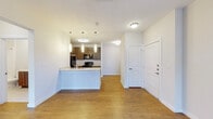 Located in Live Oak, Texas, this single-story residence offers a thoughtfully designed layout with a seamless blend of functionality and comfort. The open-concept living and kitchen area is anchored by warm wood-look flooring that extends throughout the main spaces, creating a cohesive and inviting atmosphere.

The kitchen is a standout feature, equipped with dark espresso cabinetry, light countertops, and black appliances including a range, microwave, and refrigerator. A peninsula with a double-basin sink and elegant pendant lighting above serves as both a prep space and a natural divider between the kitchen and living area, making it ideal for everyday use and entertaining.

The bedrooms offer a comfortable retreat, each appointed with plush carpeting, ceiling fans, and generous windows that invite natural light. The primary bedroom includes access to a walk-in closet and an en-suite bathroom. Additional bedrooms provide ample space and natural views through large windows with vertical or horizontal blinds.

The bathroom features a full tub-shower combination with white tile surround, chrome fixtures, and a vanity with matching dark wood cabinetry, maintaining design consistency throughout the home. Clean white walls and neutral tones throughout contribute to a bright, airy ambiance, making this residence a welcoming and practical living space.