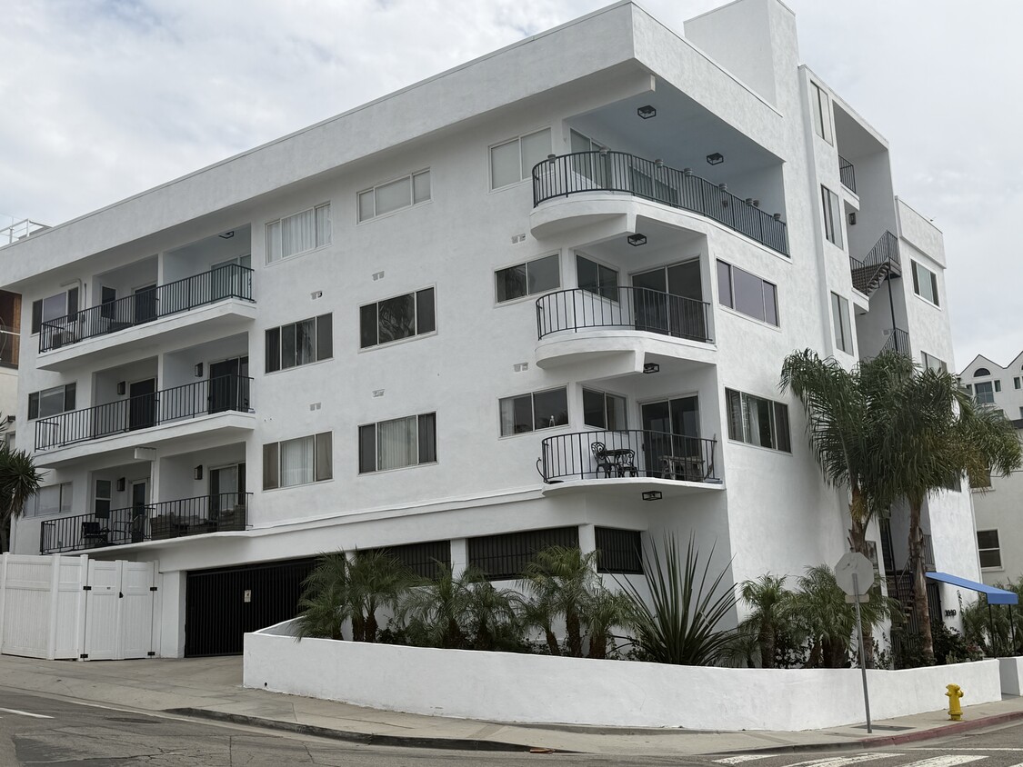 External view of building with parking garage entry on Seaside Terrance side - 1649 Appian Way