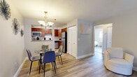 Located at 41 Highland Ave in Randolph, MA, this two-bedroom, one-bathroom residence offers a well-organized single-floor layout designed for comfortable everyday living. Light wood-style flooring runs throughout, creating a cohesive and clean aesthetic across all rooms.

The open-concept living and dining area serves as the heart of the home. The living room features a window that allows natural light to fill the space, complemented by a baseboard heating system and a textured ceiling. The dining area flows seamlessly into the kitchen, anchored by an elegant chandelier overhead. The kitchen is equipped with warm-toned wood cabinetry, granite-style countertops, stainless steel appliances including a microwave, electric range, dishwasher, and refrigerator, along with a convenient closet for additional storage.

The primary bedroom is a generously sized retreat featuring dual closets with paneled doors, light-toned flooring, and a neutral color palette. The second bedroom is bright and well-proportioned, with large windows and the same consistent flooring. The full bathroom is finished in clean white tones with overhead cabinetry for storage. A hallway connects the bedrooms and bathroom, providing a practical and efficient flow throughout the residence.