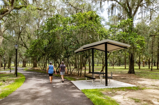 Shaded picnic tables line the walking the trails in Lady Lake's Snooky Park.