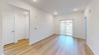 This single-story, 3-bedroom, 2-bathroom home in Anaheim, California offers a clean and modern interior designed for comfortable everyday living. The open living area features light wood-look flooring, recessed lighting, and a sliding glass door that fills the space with natural light while providing outdoor access. The kitchen is well-appointed with white shaker cabinetry, subway tile backsplash, gray quartz countertops, stainless steel appliances including a range, microwave, and dishwasher, and a convenient in-unit laundry area tucked nearby. The three bedrooms are carpeted and bright, each featuring windows with blinds that allow natural light to filter in. The primary bedroom includes a closet, while additional bedrooms offer sliding door closets and comfortable proportions. Both bathrooms are finished with wood-look flooring, white shaker vanities with gray countertops, framed mirrors, and tub-shower combinations with clean tile surrounds. A connecting hallway ties the layout together efficiently. Throughout the home, crisp white walls, consistent finishes, and thoughtful details create a cohesive, move-in-ready atmosphere suited for a range of lifestyles.