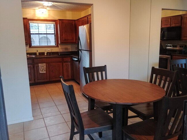 Off the living room is the dining area and full Chef's kitchen. - 2415 Idlewilde Dr
