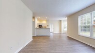Located at 3900 Suffolk Drive in Dublin, Ohio, this single-floor, 2-bedroom, 2-bathroom home offers a thoughtfully designed layout that balances comfort and functionality. The open-concept living, dining, and kitchen area serves as the heart of the home, with neutral-toned walls, wood-style flooring, and large windows that invite natural light throughout. A welcoming entrance leads directly into the spacious main living area, which flows seamlessly toward a private patio.

The kitchen features white cabinetry, granite-style countertops, and a full suite of stainless steel appliances, including a refrigerator, dishwasher, microwave, and range. A raised breakfast bar separates the kitchen from the living and dining space, adding both style and practicality.

The generously sized primary bedroom is finished with plush carpeting and a large window with outdoor views. Its en-suite bathroom includes a walk-in shower, vanity, and light wood-style flooring. The second bedroom is equally well-proportioned, also featuring carpet and a natural light-filled window. A second full bathroom with a tub-shower combination serves this room. Five closets throughout the home provide exceptional storage. A dedicated laundry area and utility room add further convenience to this well-rounded residence.