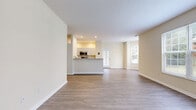 Located at 3900 Suffolk Drive in Dublin, Ohio, this single-floor, 2-bedroom, 2-bathroom home offers a thoughtfully designed layout that balances comfort and functionality. The open-concept living, dining, and kitchen area serves as the heart of the home, with neutral-toned walls, wood-style flooring, and large windows that invite natural light throughout. A welcoming entrance leads directly into the spacious main living area, which flows seamlessly toward a private patio.

The kitchen features white cabinetry, granite-style countertops, and a full suite of stainless steel appliances, including a refrigerator, dishwasher, microwave, and range. A raised breakfast bar separates the kitchen from the living and dining space, adding both style and practicality.

The generously sized primary bedroom is finished with plush carpeting and a large window with outdoor views. Its en-suite bathroom includes a walk-in shower, vanity, and light wood-style flooring. The second bedroom is equally well-proportioned, also featuring carpet and a natural light-filled window. A second full bathroom with a tub-shower combination serves this room. Five closets throughout the home provide exceptional storage. A dedicated laundry area and utility room add further convenience to this well-rounded residence.