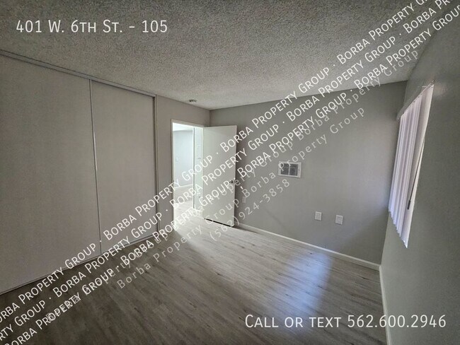 Foto del edificio - 401 W 6th St