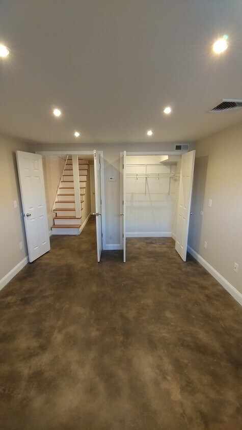 Basement bedroom with large closet. Stained concrete HEATED floors. Entire basement has full height ceilings of least 7'9". - 3115 Fleet Street