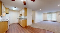 This 850 square foot apartment in Burnsville, Minnesota, offers a practical and comfortable living space. The floor plan includes two bedrooms and two full bathrooms, making it ideal for small families or roommates. The galley-style kitchen is equipped with essential appliances, including a refrigerator and stove, and features light wood cabinetry with granite countertops, providing both functionality and aesthetic appeal.

The living areas are adorned with neutral-toned carpeting, creating a cozy atmosphere throughout. Large windows in the bedrooms and living room allow for ample natural light, enhancing the sense of space. Ceiling fans in the bedrooms offer additional comfort and air circulation.

The bathrooms are designed with simplicity and cleanliness in mind, featuring white fixtures and light wood vanities. One bathroom includes a shower/tub combination, while the other has a standing shower, catering to different preferences.

The apartment's layout is efficient, with a clear separation between living and sleeping areas. The primary bedroom, measuring 160 square feet, provides a spacious retreat. A closet adds to the storage options available in the unit.

Located at 301 E Burnsville Pkwy, this apartment offers convenience with its single-floor layout and proximity to local amenities. The neutral color palette throughout allows for easy personalization, making it a versatile space for various lifestyle needs.