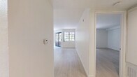 Located at 7282 Franklin Ave in the heart of Los Angeles, this one-bedroom, one-bathroom unit offers a well-organized layout across a single floor. Light wood-style flooring runs throughout, lending a clean, cohesive look to the entire space.

The combined living and dining area is generously proportioned, anchored by a classically styled wood-mantled fireplace with a gold-trimmed surround — a standout focal point of the room. A sliding glass door fills the living area with natural light and provides access to an outdoor area with lush greenery views.

The galley-style kitchen is efficiently designed with warm honey-toned wood cabinetry reaching to the ceiling, ample counter space, and a full suite of stainless steel appliances including a refrigerator, range, and dishwasher. A skylight overhead brightens the space naturally.

The spacious primary bedroom features light-filled windows framing palm tree views, reflecting the Southern California setting. It connects directly to a dedicated walk-in closet, providing generous storage.

The full bathroom is well-appointed with an extended dual-sink vanity topped with speckled countertops, a large wall mirror, and a glass-enclosed shower-tub combination. Light-toned flooring and a skylight keep the space feeling bright and open throughout.