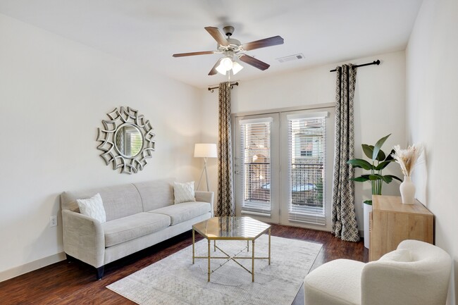 Living room with hardwood flooring and ceiling fan - Villas di Lucca