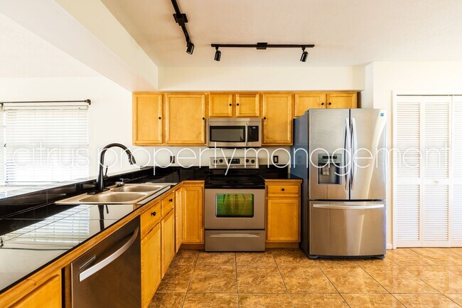 Building Photo - MetroWest 4/2.5 Corner Lot Home with Fence...