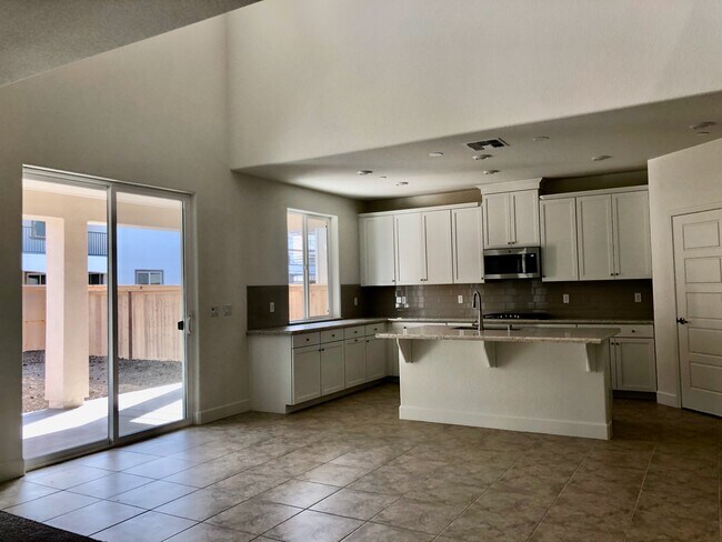 well equipped kitchen with pantry and stainless steel appliances and white cabinets - 5660 Highport Dr