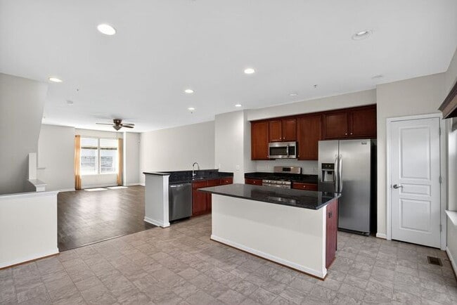Building Photo - Pet Friendly 3 level End Unit Town Home wi...