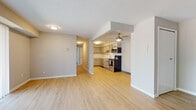 Located at 4090 Skyview Dr in Brunswick, Ohio, this single-floor unit offers a well-designed, functional layout with modern finishes throughout. The open-concept living area features light wood-tone flooring that extends seamlessly toward the kitchen, creating a bright and cohesive feel. A large sliding glass door floods the living space with natural light and provides a view of the surrounding greenery outdoors.

The kitchen is efficiently laid out and fully equipped with stainless steel appliances, including a refrigerator, electric range, and over-the-range microwave. Gray shaker-style cabinetry pairs with a classic white subway tile backsplash, while the light flooring ties the space together. A ceiling fan overhead adds a practical touch to the kitchen area.

Two bedrooms feature plush carpeting and large windows dressed with horizontal blinds, inviting natural light and outdoor views. The primary bedroom benefits from dual windows, enhancing its airy atmosphere.

The unit includes two bathrooms. The full bathroom is appointed with a white vanity featuring shaker-style cabinetry, a white countertop, and a shower-tub combination. The half bathroom offers a streamlined vanity with a mirror and hardwood-style flooring, providing convenience for guests. Neutral-toned walls throughout contribute to a clean, move-in-ready aesthetic.