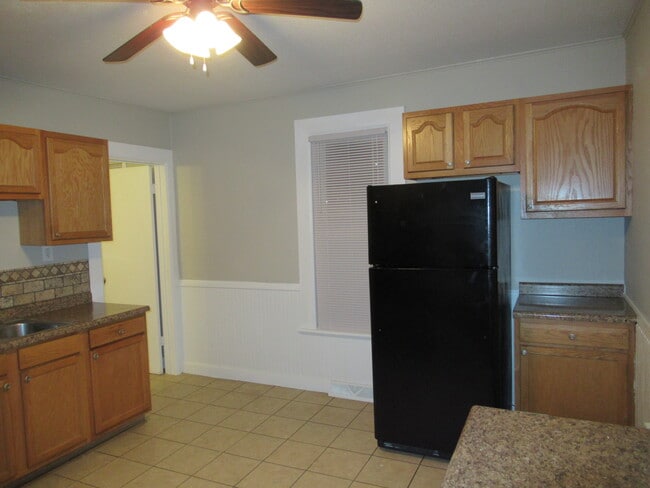 Kitchen, door to downstairs bathroom - 1320 N Morrison St