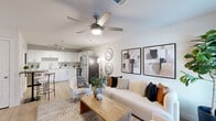 Located at 3450 Barker Cypress Rd in Houston, TX, this well-designed 2-bedroom, 2-bathroom single-floor residence makes excellent use of its space through a thoughtful, open-concept layout. Light wood-tone flooring flows seamlessly throughout, creating a cohesive and airy feel across every room.

The combined living, dining, and kitchen area serves as the heart of the home. The living room features a ceiling fan with light, neutral-toned walls, and a window that brings in natural light. The kitchen is outfitted with crisp white cabinetry, marble-style countertops, stainless steel appliances including a refrigerator, electric range, microwave, and dishwasher, plus a track lighting fixture and a pantry for additional storage.

Both bedrooms are comfortably scaled, each with its own closet. The primary bedroom offers a quiet retreat, while the second bedroom provides flexible use of space. The two bathrooms are finished with clean, modern fixtures — one featuring a backlit vanity mirror and marble-style countertop, the other with a shower-tub combination and contemporary wall accents.

Additional practical features include an in-unit laundry area and four closets spread throughout the home, providing ample storage. The overall ambiance is clean, modern, and functional.