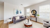 Located at 3630 Corriere Rd in Easton, PA, this well-appointed two-bedroom, two-bathroom residence offers a thoughtfully designed single-level layout with generous living space. The open-concept kitchen is a standout, featuring warm wood cabinetry, granite countertops, stainless steel appliances, and a breakfast bar with pendant lighting — seamlessly connecting to the dining and living areas finished with hardwood flooring. The living room is bright and inviting, with large windows that fill the space with natural light and offer views of the landscaped community surroundings. A cozy sitting or flex area also benefits from multiple windows framing greenery outside. The spacious primary bedroom features plush carpeting, a large window, and ample room for a full furniture arrangement. The second bedroom mirrors a similarly comfortable and airy design. Both bathrooms are finished with tile flooring, wood-framed vanities with granite countertops, and clean white fixtures; one includes a walk-in glass-enclosed shower. A dedicated closet provides additional storage. The residence is part of a well-maintained multi-building community with paved parking and mature tree-lined surroundings, conveying a calm suburban setting.