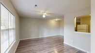 Located at 3150 Boardwalk Ln in Greenville, NC, this single-story, one-bedroom, one-bathroom unit offers a well-organized and functional layout. The combined dining and living room serves as the heart of the space, featuring warm wood-look flooring, neutral gray walls, white baseboards, and a ceiling fan with light fixture — creating a clean, inviting atmosphere. Natural light filters in through multiple windows fitted with blinds.

The kitchen is efficiently designed in an L-shaped configuration, equipped with white cabinetry, light countertops, a double stainless steel sink, and a white electric range with overhead ventilation. Wood-look flooring continues throughout, maintaining a cohesive look.

The bedroom is a comfortable, well-proportioned room carpeted for warmth, featuring a ceiling fan, two windows with outdoor views, and direct access to a walk-in closet with built-in shelving. A secondary closet and additional utility and laundry rooms provide ample storage and practicality throughout the unit.

The bathroom includes a full tub and shower combination with clean white surround. Additional utility and laundry areas round out the layout, enhancing the overall functionality of this compact yet complete living space.