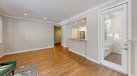 Located in San Mateo, CA, this well-appointed single-floor home offers three bedrooms and two bathrooms across a thoughtfully designed layout. Warm hardwood flooring flows throughout the entire residence, complementing a neutral color palette that creates a bright and cohesive atmosphere.

The living room is a standout space, featuring a classic fireplace with a white surround, crown molding, and large windows that frame outdoor greenery and invite generous natural light. An open pass-through connects the living area to the kitchen, which is outfitted with white shaker cabinetry, granite countertops, stainless steel appliances including a gas range and built-in microwave, and a breakfast bar—ideal for casual dining.

The bedrooms are comfortably sized and bathed in natural light from well-placed windows with outdoor views. The primary bedroom offers ample space, while additional bedrooms feature sliding closet doors with built-in storage. A hallway connects the private quarters seamlessly to the rest of the home.

The two bathrooms are clean and functional: one features a glass-enclosed walk-in shower with a granite surround and a window for ventilation, while the other includes a full soaking tub with a tiled surround. A dedicated closet and hallway round out this efficiently designed and move-in-ready home.
