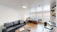 Located at 1231 S Allen Street in State College, PA, this well-designed studio offers a smart, functional layout across a single floor. The open main living area seamlessly integrates the sleeping and lounging spaces, featuring light hardwood flooring, crisp white walls, and windows that invite natural light. The living area provides ample room for seating and a bed, creating a comfortable and versatile living environment.

The galley-style kitchen is thoughtfully appointed with white shaker cabinetry, quartz countertops, stainless steel appliances including a full-size refrigerator, dishwasher, and range, as well as a stainless steel undermount sink. Open shelving adds both storage and visual interest, while light flooring keeps the space feeling bright and cohesive.

The full bathroom features a clean, modern aesthetic with white vanity cabinetry, a white countertop, and a tiled shower-tub combination with grey subway tile accents. Two closets provide practical storage solutions throughout the unit. A private patio extends the living space outdoors, offering a dedicated area for fresh air and relaxation. The overall design is clean and contemporary, making efficient use of every square foot for comfortable everyday living.