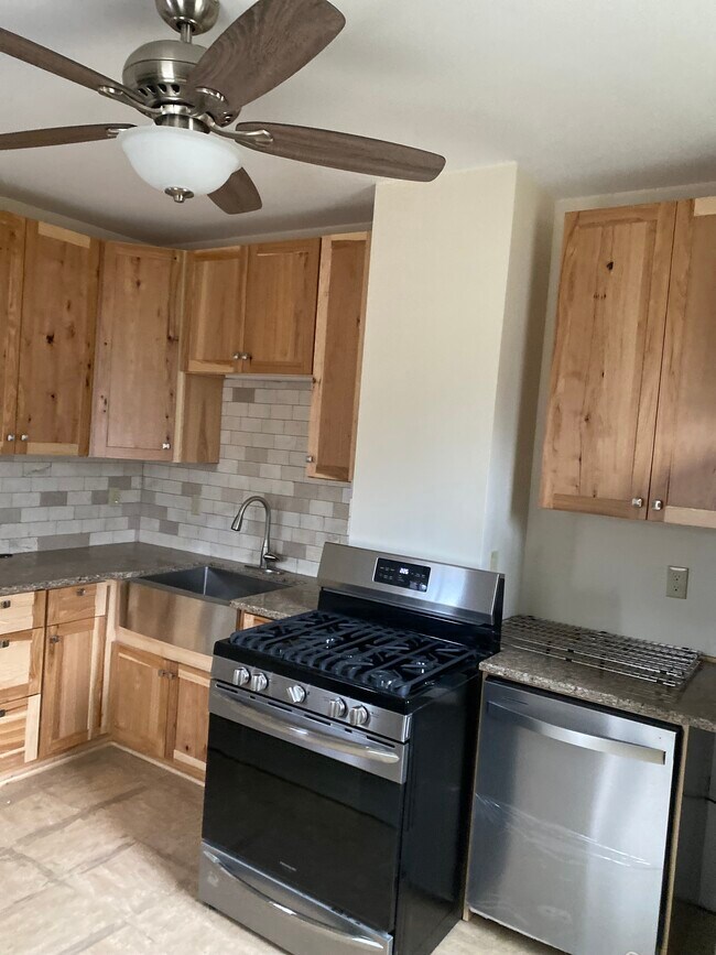 hickory cabinets and marble backsplash - 183 Main St