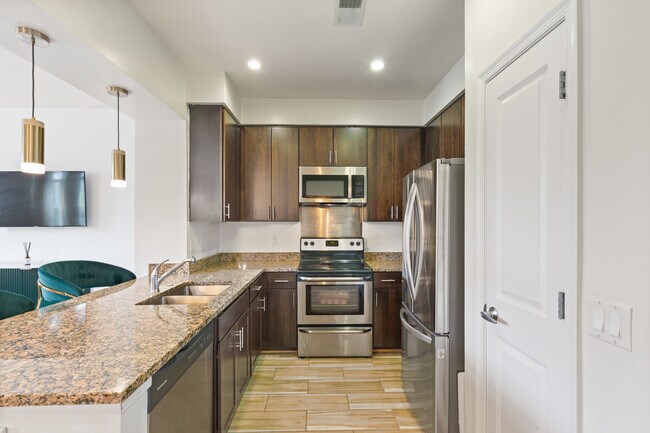 Double sink, stainless steel dishwasher, side-by-side refrigerator with water dispenser and microwav - 2536 Sheridan Rd SE