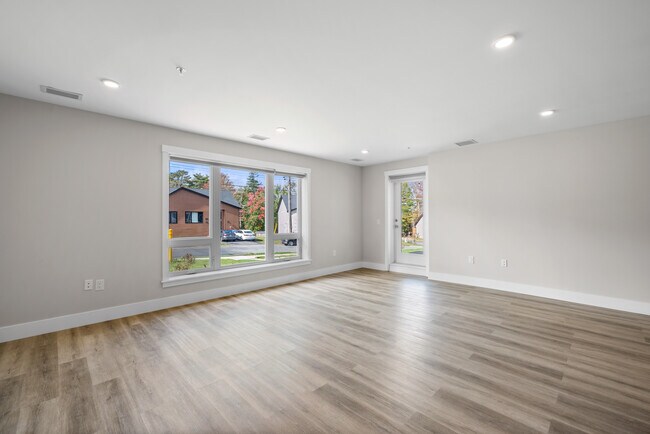 Photo du bâtiment - 1 Bedroom + Den Elation Suites - Plan B