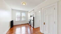 Located at 66 Adelaide St in Detroit's vibrant Midtown neighborhood, this efficient one-bedroom, one-bathroom unit offers a well-designed layout across a single floor. Rich, polished hardwood floors flow seamlessly throughout every room, adding warmth and character to the bright, neutral interior.

The combined living, dining, and kitchen area forms the heart of the unit. Large double-pane windows with blinds allow ample natural light to fill the open space. The kitchen is efficiently integrated into the main living area, featuring white cabinetry, stainless steel appliances including a refrigerator, range, and microwave, complemented by a clean white finish that maintains a cohesive aesthetic.

The bedroom is a comfortable, well-proportioned retreat, featuring crown molding, natural light from a window, and notable storage — two dedicated closets provide generous organization options rarely found in compact units.

The bathroom is accessible from the main living area. Classic white panel doors with brass hardware are found throughout, contributing to a timeless, clean design sensibility. Crown molding and wide baseboards add architectural detail that elevates the overall finish of the space.

This unit combines practical layout efficiency with classic Detroit residential character, making it a functional and charming urban living option.