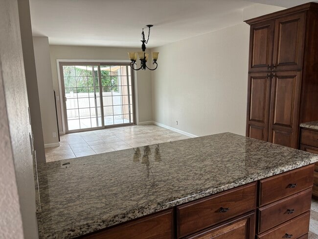 Kitchen island and dining area - 6050 Henderson Dr