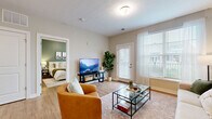 Located at 5151 Kingsley Park Dr in Columbus, OH, this single-floor, one-bedroom, one-bathroom residence offers a thoughtfully designed layout that maximizes comfort and functionality. Light wood-style flooring flows throughout the home, complemented by neutral wall tones that create a bright, welcoming atmosphere.

The open-concept living and kitchen area serves as the heart of the home. The living space features large windows with sheer curtains that invite abundant natural light, along with a private patio door providing direct outdoor access. The kitchen is outfitted with rich espresso-toned cabinetry, granite countertops, a peninsula with bar seating, and black appliances, including a refrigerator, range, and built-in microwave. A dedicated pantry adds convenient storage.

The bedroom offers a serene retreat, highlighted by a soft sage accent wall, large windows with sheer drapes, and ample closet space. The bathroom features white cabinetry, granite countertops, a walk-in shower, and modern fixtures. Additional conveniences include in-unit laundry and two closets. The space is completed by a private patio, ideal for outdoor relaxation. This residence combines practical design with modern finishes throughout.