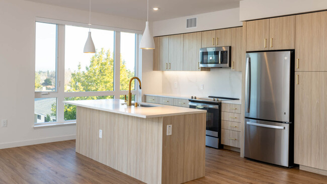 Kitchen with Stainless Steel Appliances and Quartz Countertops - Lorien